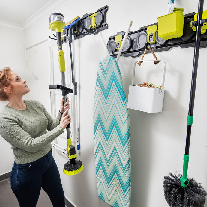 Ryobi LINK used in the laundry to store an ironing board and cleaning tools