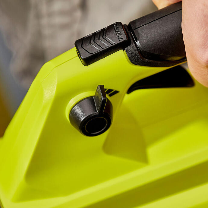Close up of RYOBI garden blower handle with hand  