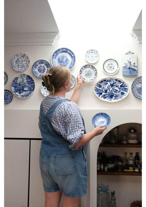 Brooke hangs plates to create gallery wall.