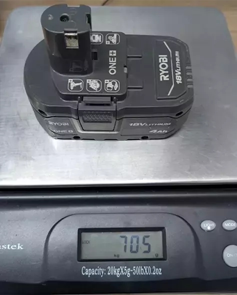 Genuine RYOBI 18V ONE+ Battery on scale